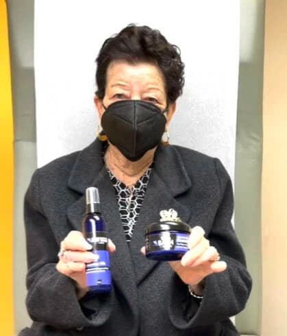 Woman about to drink a cup of mud water